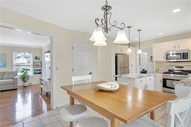 The kitchen and eating area flows into the family room