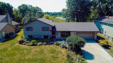 Stunning perennial gardens and wetland views.