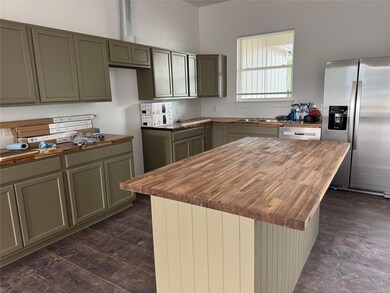 Kitchen featuring appliances with stainless steel