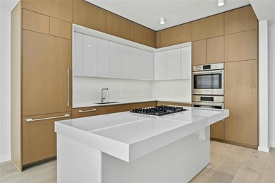 Kitchen featuring a sink, light wood-style floori