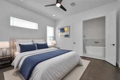 Retreat to luxury in this expansive primary bedroo