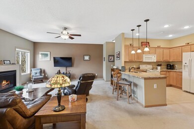 Another view of the kitchen and living room