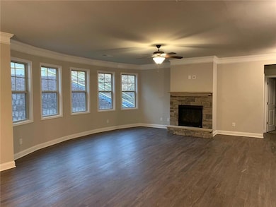 Unfurnished living room featuring a wealth of natu