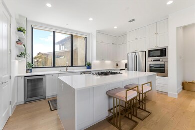 Kitchen with stainless steel appliances, beverage
