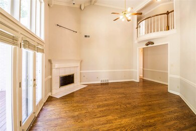 GREAT ROOM HAS HIGH SMOOTH CEILING AND FIRE PLACE.