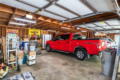 Extra large 3 car garage with storage and walk aro