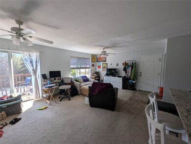 Sunny Living room featuring sliding glass doors to