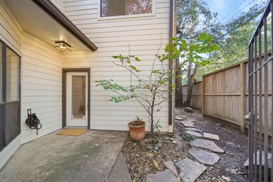 This cozy entryway is secured behind a gate with a