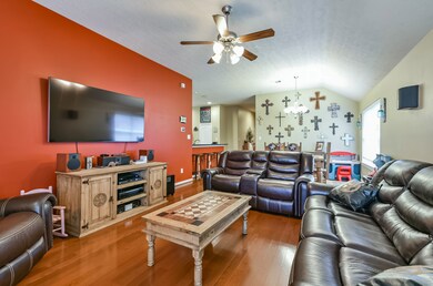 Living room looking towards dining room and kitchen bar on the left side.