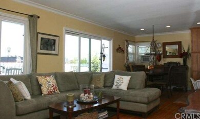 Living room opens to the 350 sq. ft. deck with oce
