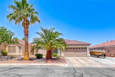 Mediterranean / spanish-style home with an attache
