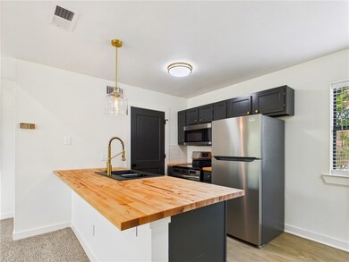 Kitchen featuring appliances with stainless steel