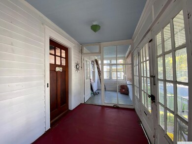 Cozy porch (27 x 7) is divided into 2 sections.