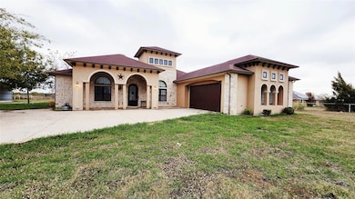 Mediterranean / spanish house with a garage and a 