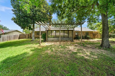 View of yard with a sunroom