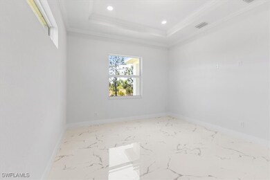 Spare room with recessed lighting, a raised ceilin