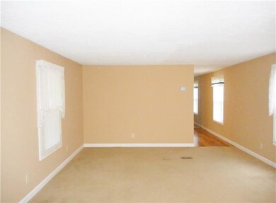 Open style living room with neutral carpet!