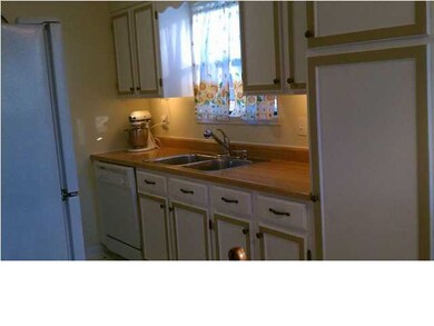 A bright and airy kitchen is ready to entertain fa