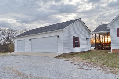 Three car detached garage with a storm shelter inside