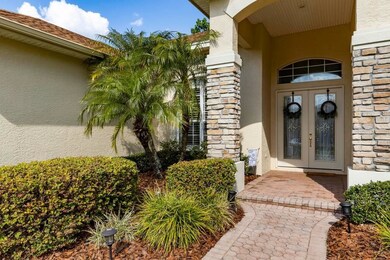 DOUBLE LEADED GLASS ENTRY DOORS with STONE COLUMNS
