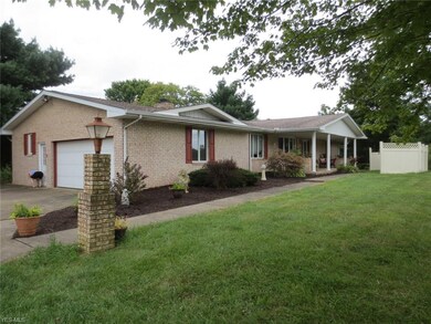 All brick ranch with partial privacy fence