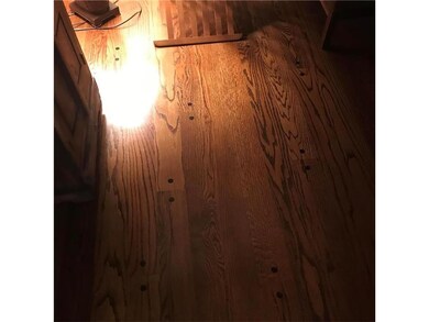 Hardwoods throughout home, including under carpet 