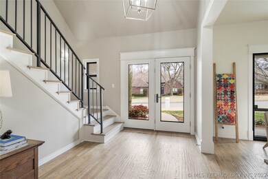Wood trimmed windows/doors; neutral grey walls and