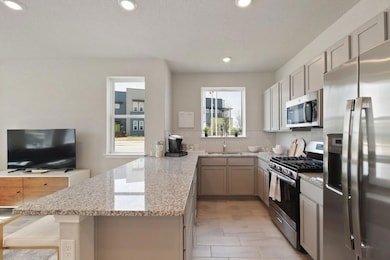 Kitchen featuring appliances with stainless steel