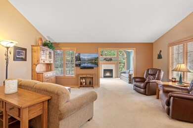 Sprawling main level living room looking into sunroom.