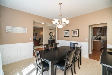 Dining Room has custom wainscoting and is located 