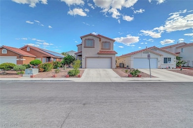 View of front of home with concrete driveway, a re