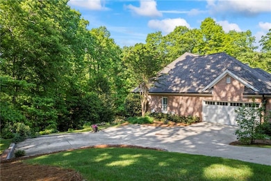 View of front facade featuring concrete driveway, 