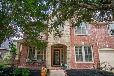 Beautiful elevation with stone and brick on the front of this gorgeous home!