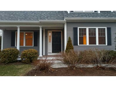 Exterior Front. Beautiful plantings detail this tw