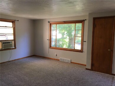 Spacious living room with large a beautiful window
