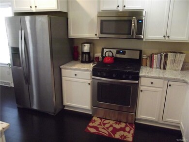 Plenty of counterspace. Neutral white cabinetry. C