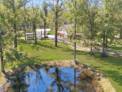 aerial view of land including pond