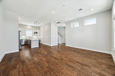 The living room flows seamlessly into the kitchen.