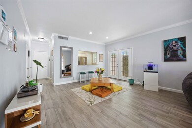 Spacious living/dining area with abundance of natu