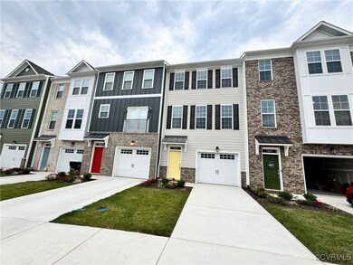 Townhome / multi-family property featuring a garage