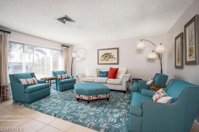 Tiled living area with a textured ceiling