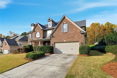 Traditional-style house featuring brick siding and driveway