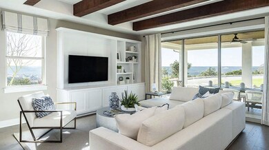 Living area with plenty of natural light, a ceili