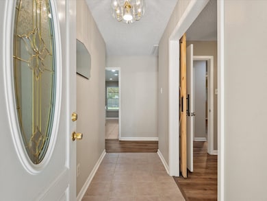Newer Fiberglass Door into Entry Way with 3rd Bedr