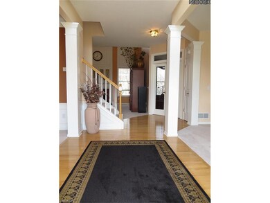 2 Story Foyer with Gleaming Hardwood Floor.