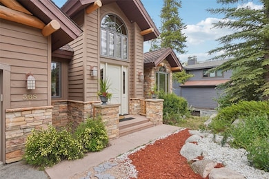 Entrance to property with stone siding