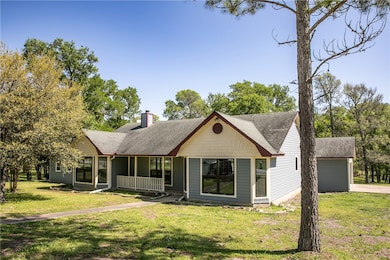 View of front of home featuring covered porch, a c