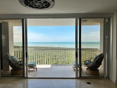 Doorway to outside featuring a water view, a beach