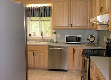 Bright open kitchen with plenty of cabinets and co