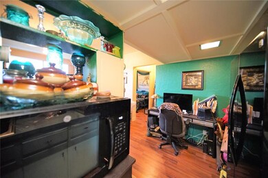 Smooth-top stove and double-door fridge are in bla